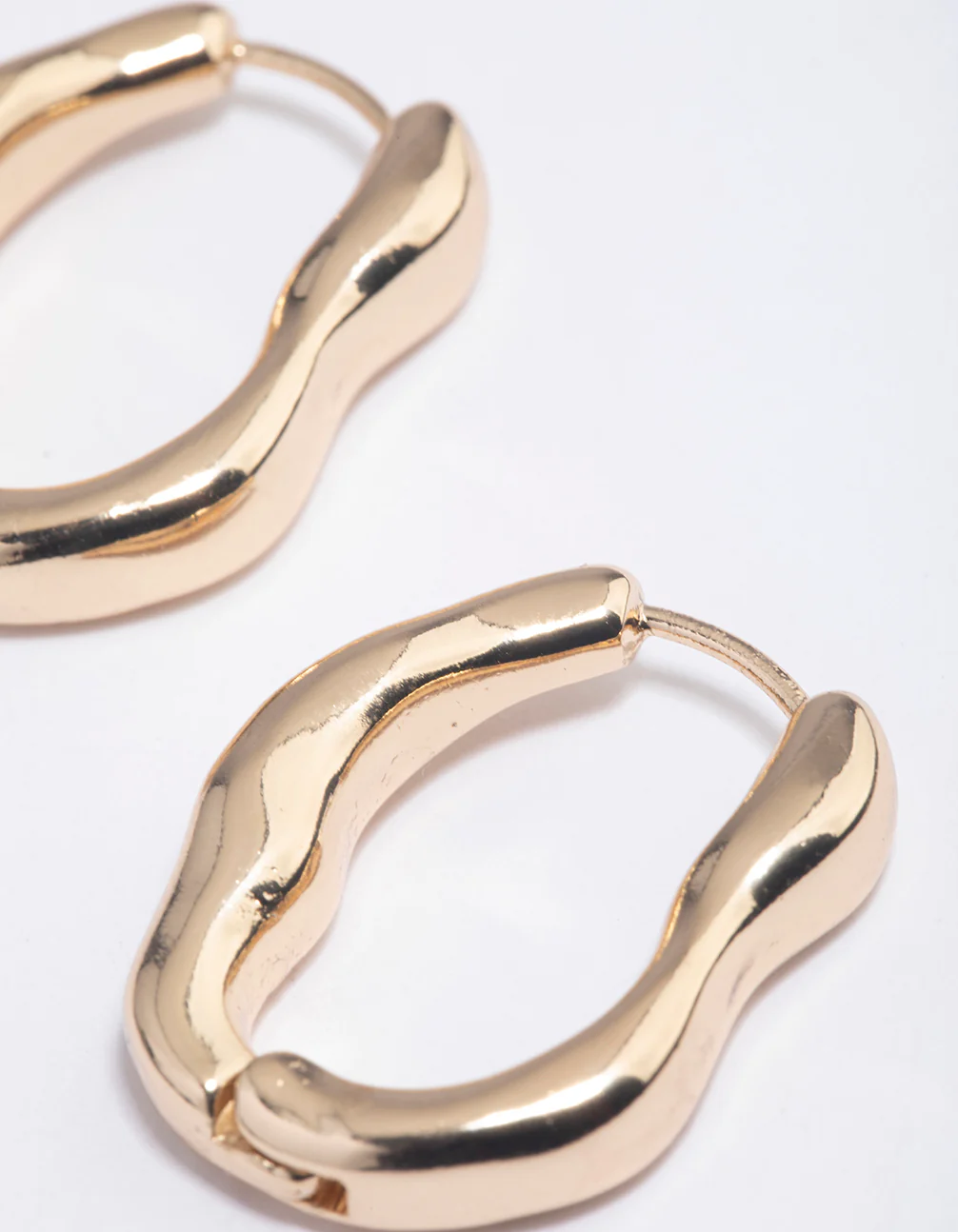 Gold Molten Oval Huggie Earrings - Image 3