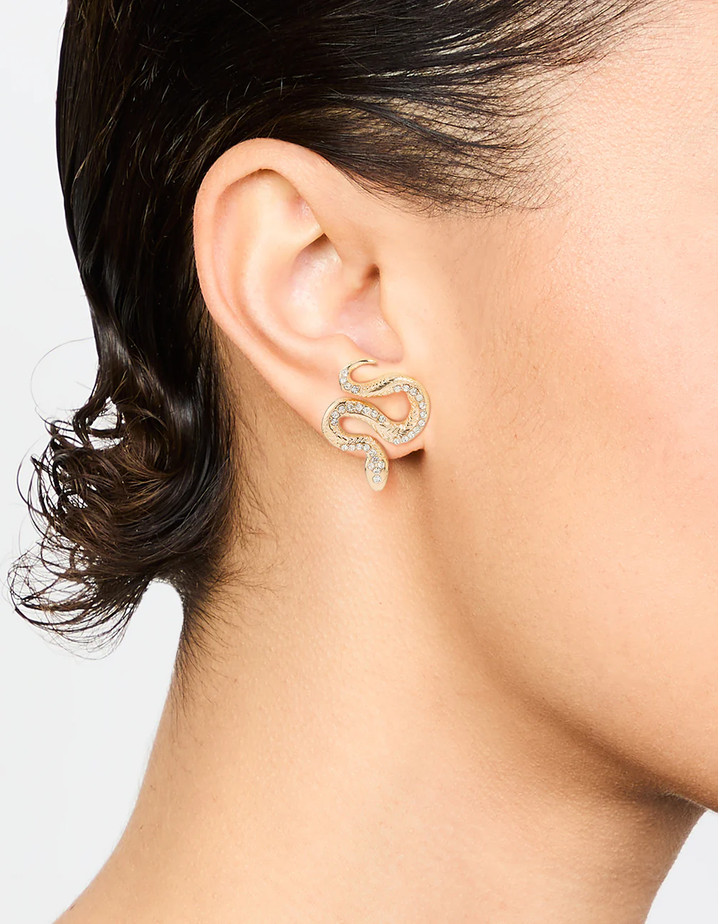 Gold Curved Snake Stud Earrings - Image 2