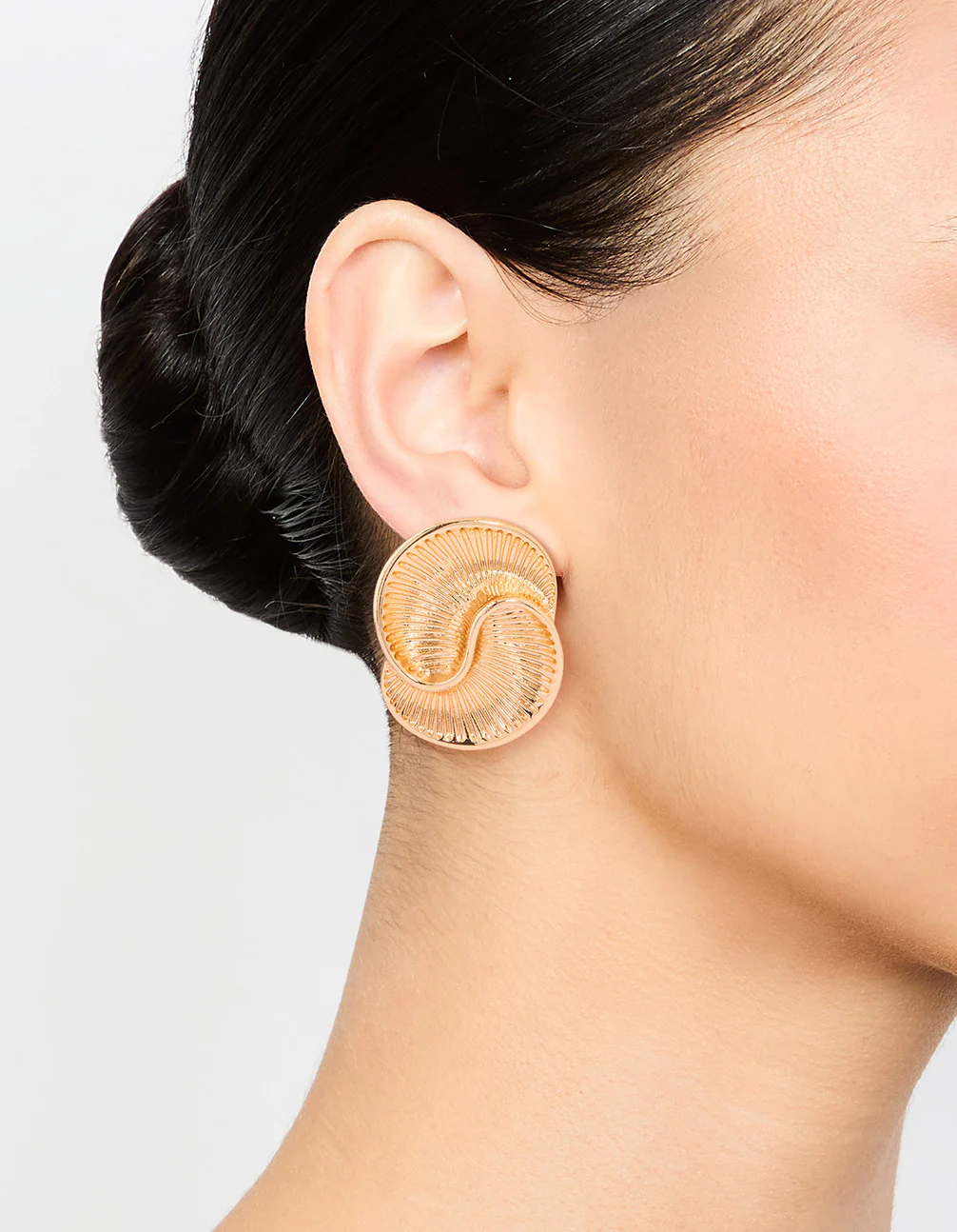Gold Ribbed Swirl Small Stud Earrings - Image 2